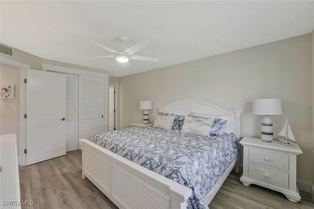 354 Harbour Dr Unit 354, Naples, FL 34103 - bedroom featuring light wood-style floors, a closet, and ceiling fan