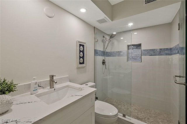 354 Harbour Dr Unit 354, Naples, FL 34103 - full bathroom featuring tiled shower, toilet, vanity, and recessed lighting
