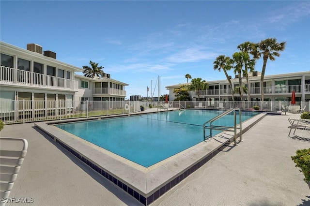 354 Harbour Dr Unit 354, Naples, FL 34103 - community pool featuring fence