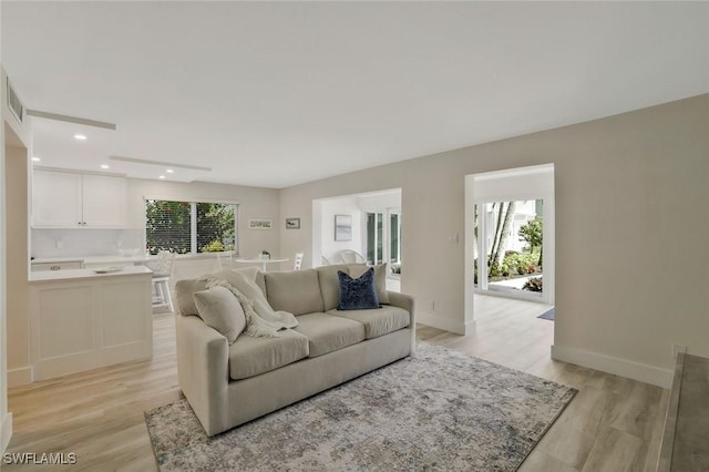 354 Harbour Dr Unit 354, Naples, FL 34103 - living area with light wood-style flooring, recessed lighting, and baseboards