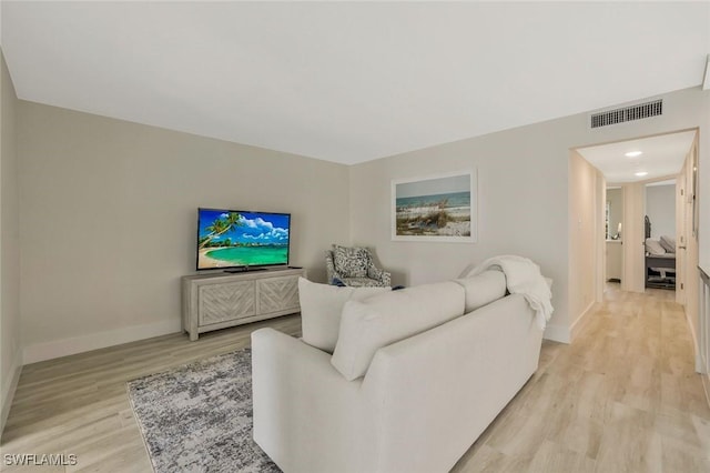 354 Harbour Dr Unit 354, Naples, FL 34103 - living room with light wood-style flooring and baseboards