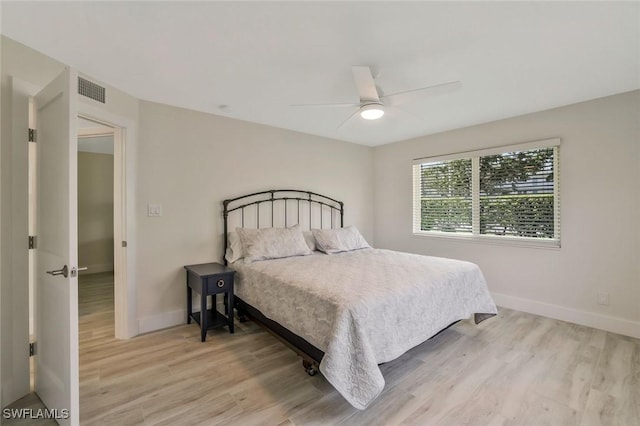 354 Harbour Dr Unit 354, Naples, FL 34103 - bedroom with light wood-style floors, baseboards, and a ceiling fan