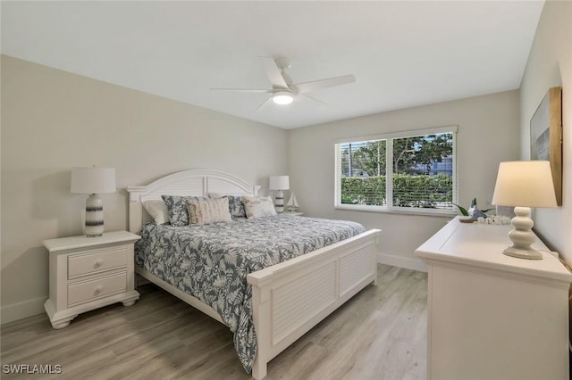 354 Harbour Dr Unit 354, Naples, FL 34103 - bedroom featuring light wood finished floors, baseboards, and a ceiling fan