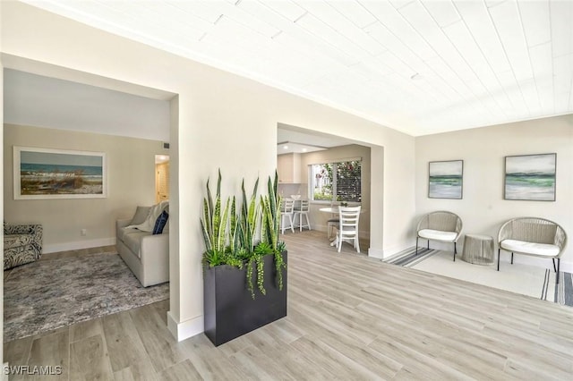 354 Harbour Dr Unit 354, Naples, FL 34103 - living room with light wood-style floors and baseboards