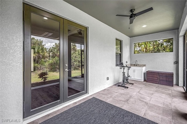 79 41st Ave NE, Naples, FL 34120 - sunroom with french doors and a sink