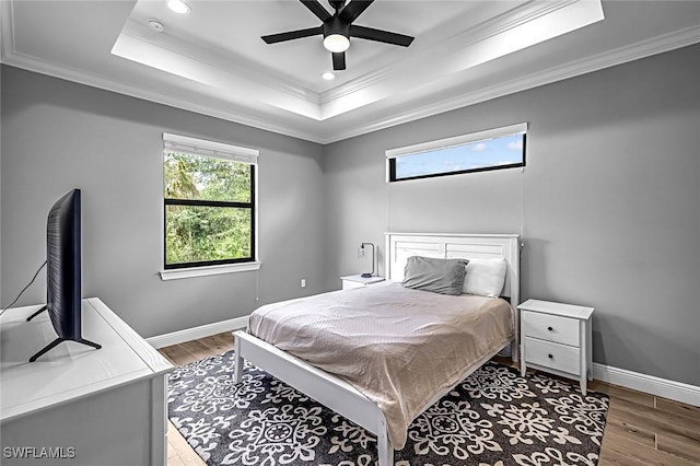 79 41st Ave NE, Naples, FL 34120 - bedroom featuring a raised ceiling, crown molding, light wood-style floors, recessed lighting, and baseboards