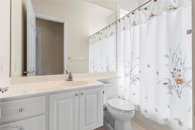 full bath with toilet and vanity