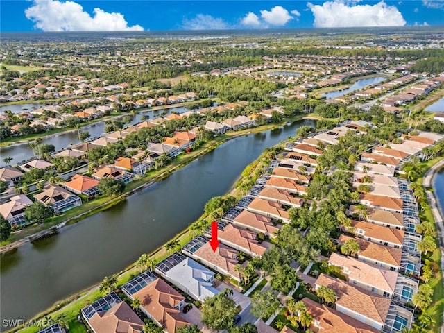aerial overview of property's location with nearby suburban area and a large body of water