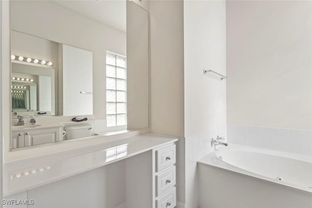 full bathroom with a bath and vanity