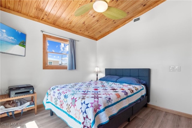 150 Pearl St, Fort Myers Beach, FL 33931 - bedroom with wooden ceiling, vaulted ceiling, wood finished floors, and baseboards