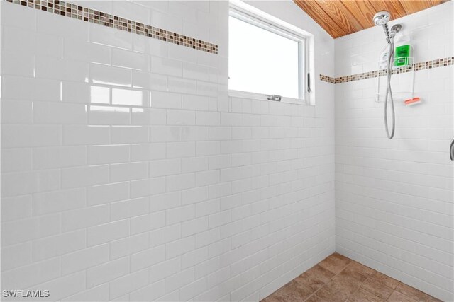 150 Pearl St, Fort Myers Beach, FL 33931 - full bathroom with wooden ceiling, a tile shower, and tile patterned floors