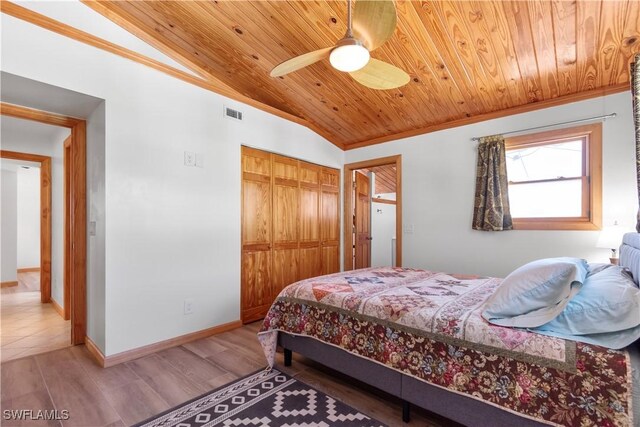 150 Pearl St, Fort Myers Beach, FL 33931 - bedroom with wood ceiling, vaulted ceiling, a closet, wood finished floors, and a ceiling fan