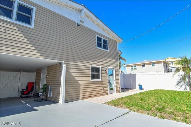 150 Pearl St, Fort Myers Beach, FL 33931 - rear view of house featuring a patio area