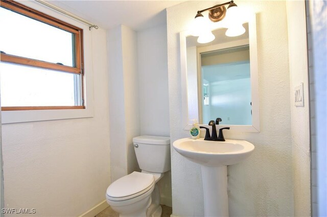150 Pearl St, Fort Myers Beach, FL 33931 - bathroom with toilet and baseboards