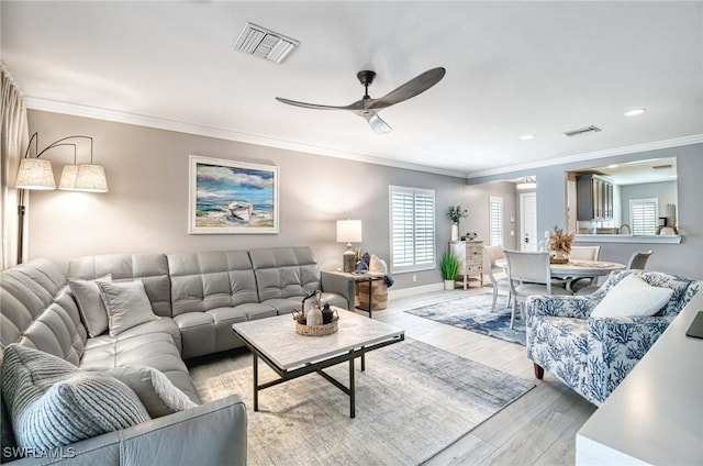 8661 Querce Ct, Naples, FL 34114 - living area with a ceiling fan, light wood-type flooring, ornamental molding, baseboards, and recessed lighting