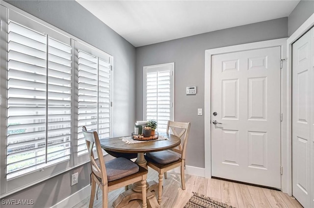 8661 Querce Ct, Naples, FL 34114 - dining room featuring light wood finished floors, plenty of natural light, and baseboards