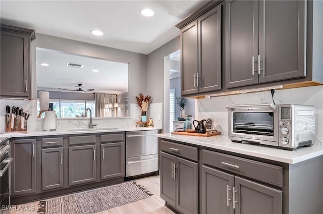 8661 Querce Ct, Naples, FL 34114 - kitchen featuring stainless steel dishwasher, a sink, gray cabinets, recessed lighting, and a ceiling fan