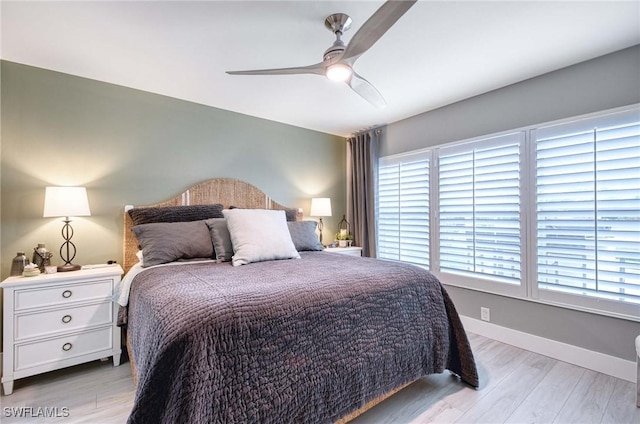 8661 Querce Ct, Naples, FL 34114 - bedroom featuring light wood-type flooring, a ceiling fan, and baseboards
