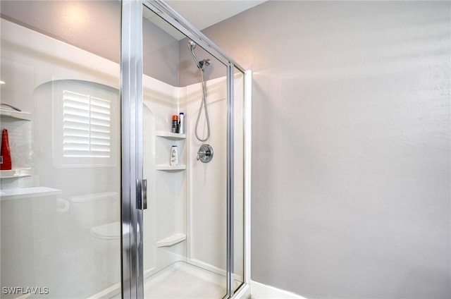 8661 Querce Ct, Naples, FL 34114 - bathroom with a shower stall and toilet