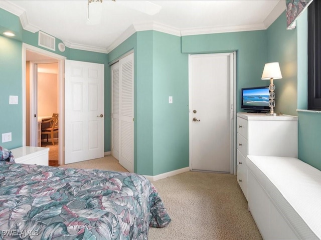840 S Collier Blvd Unit 706, Marco Island, FL 34145 - bedroom with light colored carpet, ornamental molding, a closet, ceiling fan, and baseboards