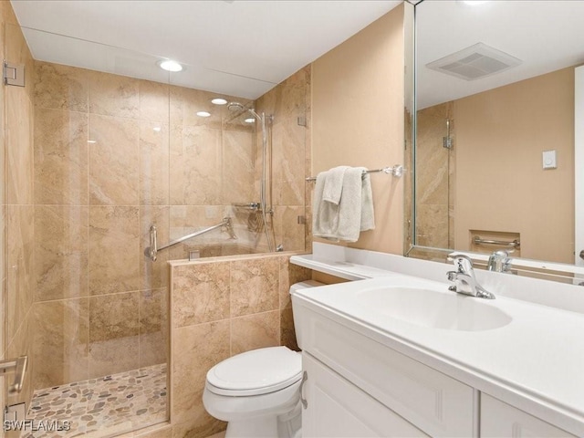 840 S Collier Blvd Unit 706, Marco Island, FL 34145 - bathroom featuring toilet, tiled shower, vanity, and recessed lighting