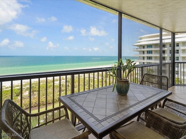840 S Collier Blvd Unit 706, Marco Island, FL 34145 - balcony with view of water and beach and outdoor dining space