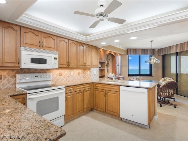 840 S Collier Blvd Unit 706, Marco Island, FL 34145 - kitchen with white appliances, a sink, a peninsula, light stone counters, and recessed lighting