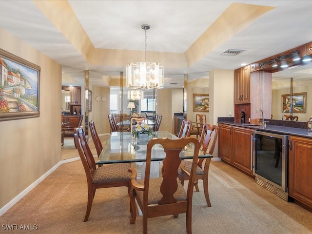 840 S Collier Blvd Unit 706, Marco Island, FL 34145 - dining room with beverage cooler, light colored carpet, a chandelier, bar with sink, and baseboards