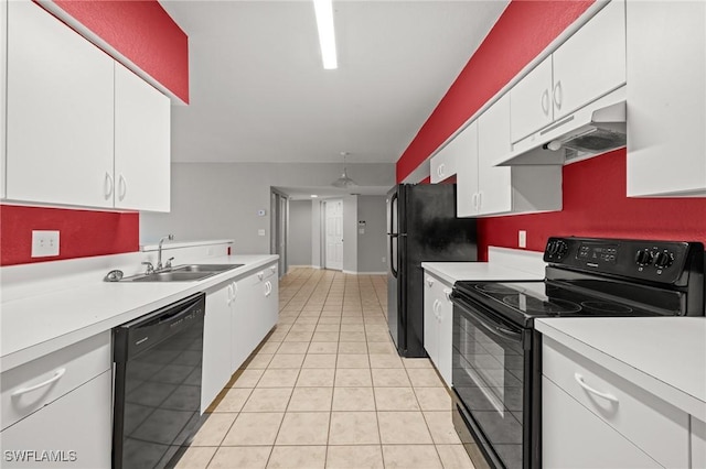 27075 Matheson Ave Unit 105, Bonita Springs, FL 34135 - kitchen with black appliances, a sink, under cabinet range hood, and light countertops