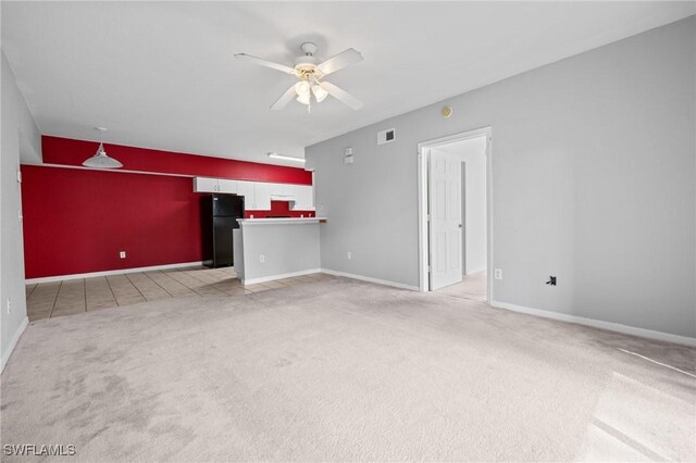 27075 Matheson Ave Unit 105, Bonita Springs, FL 34135 - unfurnished living room featuring carpet, a ceiling fan, baseboards, and tile patterned floors
