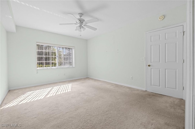 27075 Matheson Ave Unit 105, Bonita Springs, FL 34135 - carpeted empty room featuring a ceiling fan, a smoke detector, and baseboards