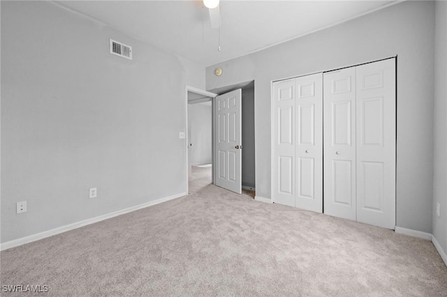27075 Matheson Ave Unit 105, Bonita Springs, FL 34135 - unfurnished bedroom with carpet floors, a closet, baseboards, and ceiling fan