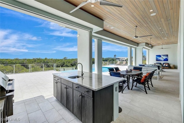 26906 Mclaughlin Blvd, Bonita Springs, FL 34134 - view of patio / terrace featuring a ceiling fan and a sink