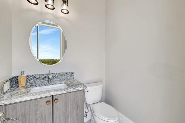 26906 Mclaughlin Blvd, Bonita Springs, FL 34134 - half bathroom with toilet and vanity