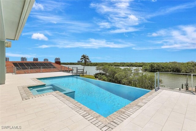 26906 Mclaughlin Blvd, Bonita Springs, FL 34134 - view of pool featuring a pool with connected hot tub, a patio area, and a water view