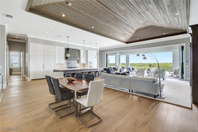 26906 Mclaughlin Blvd, Bonita Springs, FL 34134 - dining space featuring crown molding, wood ceiling, a tray ceiling, healthy amount of natural light, and baseboards