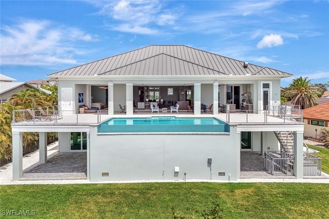 26906 Mclaughlin Blvd, Bonita Springs, FL 34134 - rear view of house featuring an outdoor hangout area, a standing seam roof, a patio, and stairs