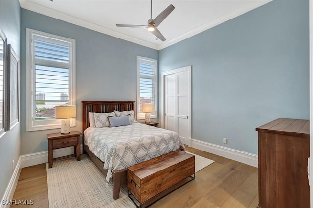 26906 Mclaughlin Blvd, Bonita Springs, FL 34134 - bedroom featuring light wood-style floors, baseboards, a ceiling fan, and ornamental molding