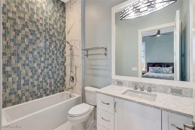 26906 Mclaughlin Blvd, Bonita Springs, FL 34134 - ensuite bathroom with toilet, vanity, shower / bath combination, and a ceiling fan