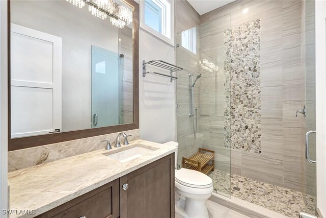 26906 Mclaughlin Blvd, Bonita Springs, FL 34134 - full bath with a stall shower, toilet, and vanity
