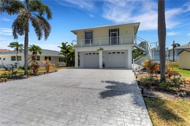 4471 Mariner Rd, Bonita Springs, FL 34134 - beach home with stairs, decorative driveway, and an attached garage