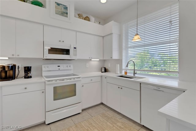 4471 Mariner Rd, Bonita Springs, FL 34134 - kitchen featuring white appliances, a sink, light countertops, white cabinets, and light tile patterned floors