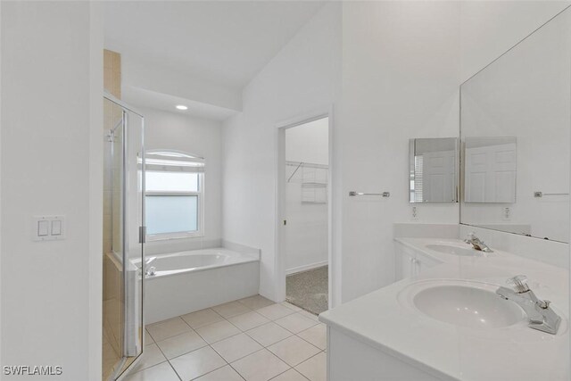 1223 Whiteheart Ave, Marco Island, FL 34145 - full bathroom featuring a shower stall, tile patterned flooring, a garden tub, a walk in closet, and double vanity