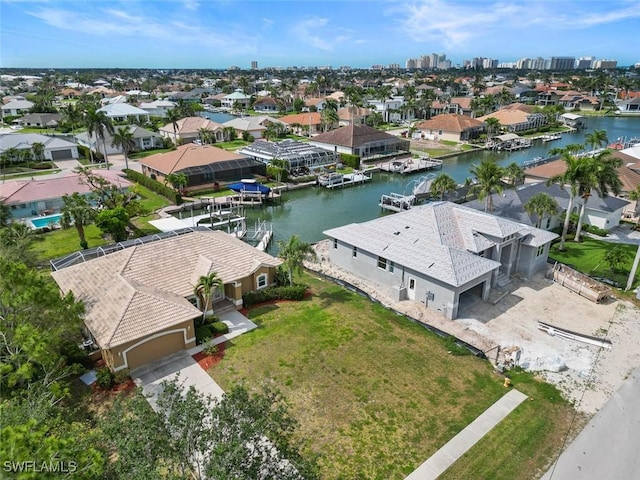 aerial view of residential area with a large body of water