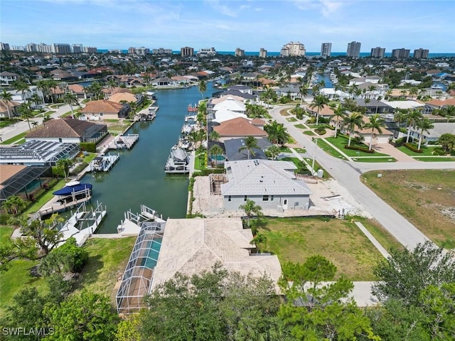 view of urban area with a nearby body of water and nearby suburban area