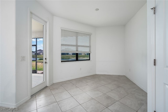 3434 Nombella Ct, Fort Myers, FL 33905 - empty room featuring light tile patterned floors and baseboards