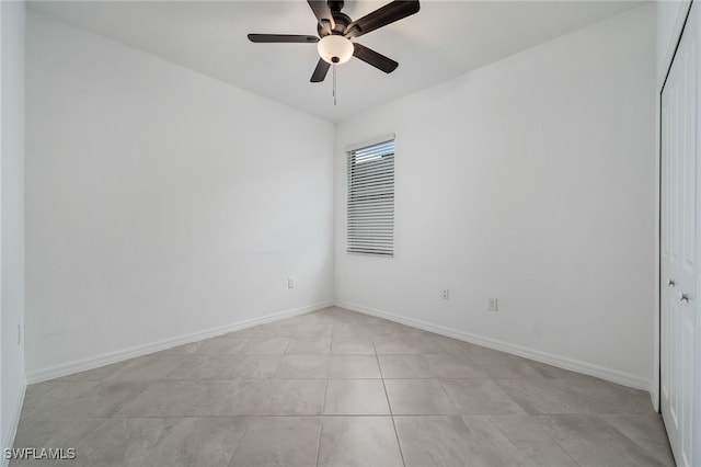 3434 Nombella Ct, Fort Myers, FL 33905 - spare room with a ceiling fan, light tile patterned floors, and baseboards