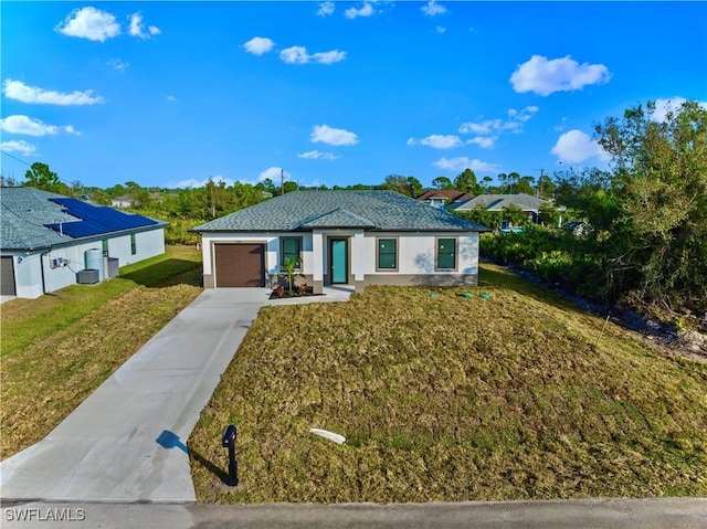 view of front of home featuring a garage, a front lawn, driveway, and stucco siding