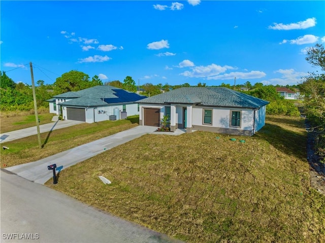 ranch-style home with driveway, a garage, a front lawn, and stucco siding