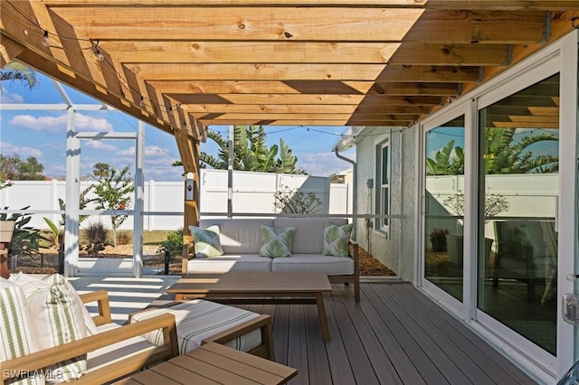 deck featuring fence and an outdoor living space